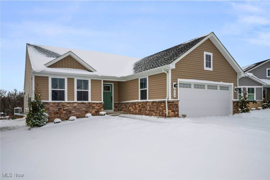 Available NOW with no construction wait! This extra-spacious, move-in ready RANCH home features a covered deck, full basement with egress windows, and is nicely appointed throughout with around $40,000 in selected upgrades. It is located on a premium cul-de-sac property with no neighbors in the back, and sits further back with an extra-long driveway and more privacy in the Hidden Lakes Development - Lakemore Village. This community provides the opportunity to simplify your lifestyle with a low monthly fee that includes mowing, fertilization, yearly mulch, and snow plowing. The open-concept interior, Grand Cayman plan, includes upgraded cabinets, granite countertops, stainless steel appliances, and LVP flooring in the common areas. A first-floor laundry room includes a washer and dryer. The primary suite has a large walk-in closet and an en-suite bath with a walk-in shower and double sinks. The full basement with egress windows provides abundant natural light, generous storage, rough-in plumbing for a future full bathroom, and excellent potential for additional living space, a home office, guest suite, or recreation area. The owner has painted/finished garage walls, and added washer/dryer since moving in. Located near Springfield Lake with scenic trails, fishing, and more. Conveniently located near I-77, I-76, shopping, dining, and many other local attractions.