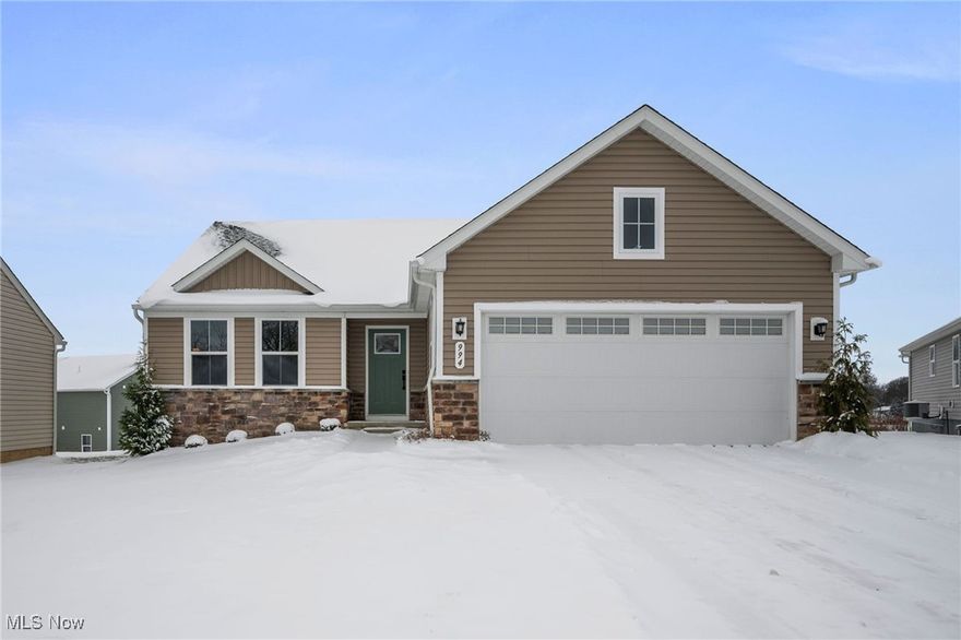 Available NOW with no construction wait! This extra-spacious, move-in ready RANCH home features a covered deck, full basement with egress windows, and is nicely appointed throughout with around $40,000 in selected upgrades. It is located on a premium cul-de-sac property with no neighbors in the back, and sits further back with an extra-long driveway and more privacy in the Hidden Lakes Development - Lakemore Village. This community provides the opportunity to simplify your lifestyle with a low monthly fee that includes mowing, fertilization, yearly mulch, and snow plowing. The open-concept interior, Grand Cayman plan, includes upgraded cabinets, granite countertops, stainless steel appliances, and LVP flooring in the common areas. A first-floor laundry room includes a washer and dryer. The primary suite has a large walk-in closet and an en-suite bath with a walk-in shower and double sinks. The full basement with egress windows provides abundant natural light, generous storage, rough-in plumbing for a future full bathroom, and excellent potential for additional living space, a home office, guest suite, or recreation area. The owner has painted/finished garage walls, and added washer/dryer since moving in. Located near Springfield Lake with scenic trails, fishing, and more. Conveniently located near I-77, I-76, shopping, dining, and many other local attractions.