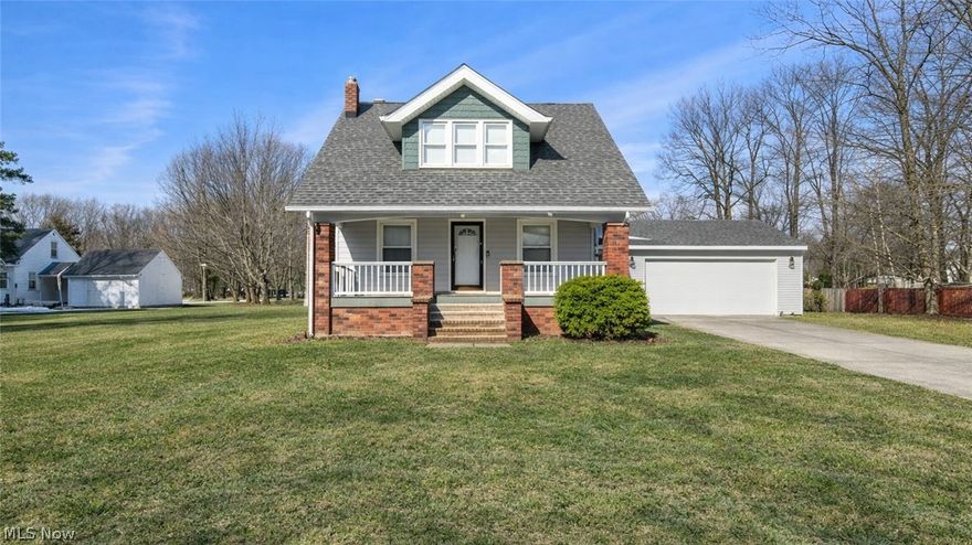 Welcome home to a beautiful three-bedroom, two-full-bath Richmond Heights Cape Cod offering charm paired with extensive modern improvements. Situated on a private lot set back from the street, gracious outdoor space including a (2) car garage, long driveway and inviting front porch — providing both privacy and curb appeal. This home offers a spacious living room with a cozy fireplace, formal dining room perfect for entertaining. Updated kitchen with modern countertops, all appliances included, updated flooring, and stylish backsplash. Two nicely updated full bathrooms, first-floor full bath & first-floor laundry for added functionality.  The unfinished basement adds valuable additional living space — ideal for a future recreation room, home office, entertainment area & storage — complete with glass block windows for security, efficiency, and natural light. Additional updates include: roof, driveway, garage, updated electrical, furnace, plumbing, hot water tank & central air. The third-floor walk-up offers incredible flexibility for additional storage & bonus space. Don't miss the opportunity to call this property Home!