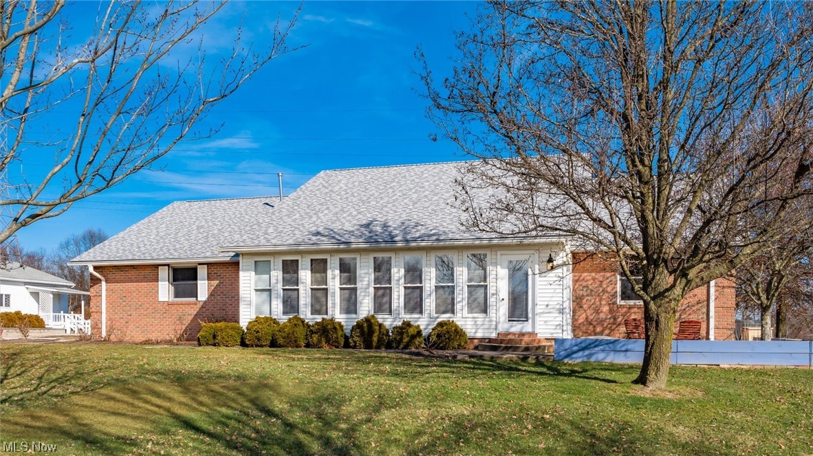 Step into this stunning 3 bed, 4 bath brick ranch nestled on 21+ acres of serene privacy. Admire the meticulous landscaping, expansive fields, and lush woods, all visible from two charming sunrooms. The spacious kitchen boasts modern appliances, granite countertops, elegant glass cabinets, a stylish tile backsplash, pantry, and a convenient island/breakfast bar, seamlessly flowing into a generous dining area and formal living room. Retreat to the master suite featuring a luxurious bath, walk-in closet, and a rejuvenating step-in shower. A tranquil 19x14 all-season room awaits, overlooking the picturesque wooded backyard through extra-wide sliding doors. Double closets adorn every bedroom, complemented by laminate flooring throughout. Space of kitchen offers a sizable laundry room, half bath, and ample storage. Downstairs, discover a family room with room for a fireplace insert, a possible additional bedroom, an additional full bath, and a convenient kitchenette. Outside, a detached 30x30 garage with a covered porch, workbench, and additional sheds await, along with a greenhouse equipped with a propane heater and water supply. Delight in the quiet sounds of nature from the patio, while appreciating recent upgrades such as a newer roof with a 50-year warranty, leaf guard, Lennox furnace, water heaters, pressure tank, generator, and insulated doors/openers. Additional amenities include security cameras, a driveway alarm, and an electric gate. With minerals included, this property offers a rare blend of comfort and functionality, a testament to years of attentive maintenance and care.