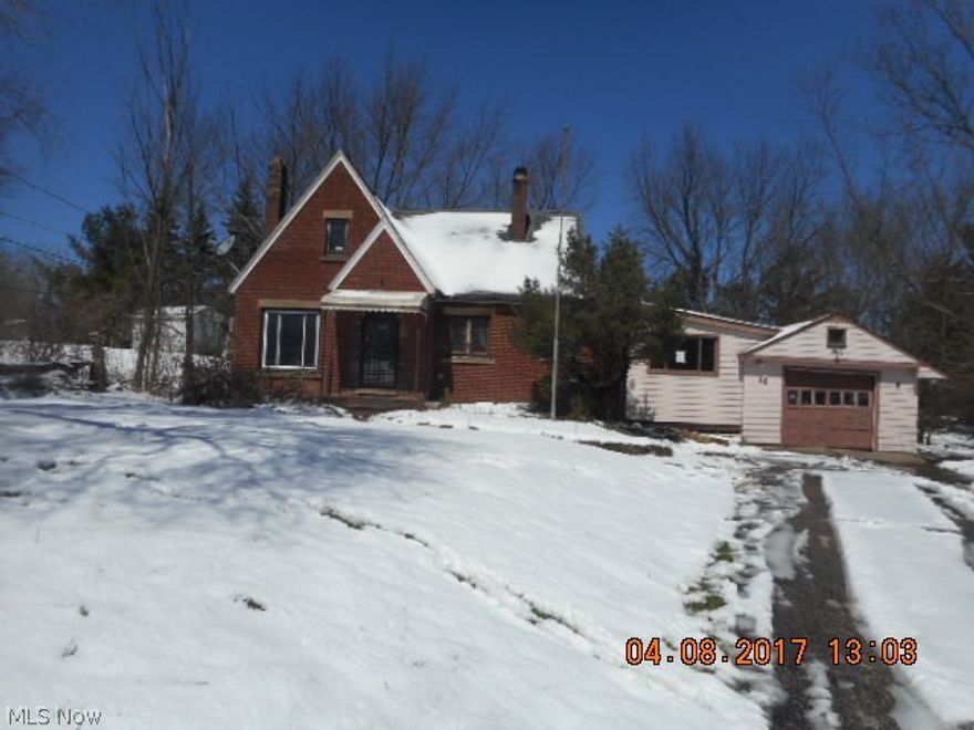 Charming brick bungalow in need of your skills and vision. Home features hardwood flooring on the first floor, a formal dining room, living room with fireplace, enclosed breezeway and attached garage, all on a lovely .65 acre lot. Great location in Broadview with easy access to I-77. Love the price too!