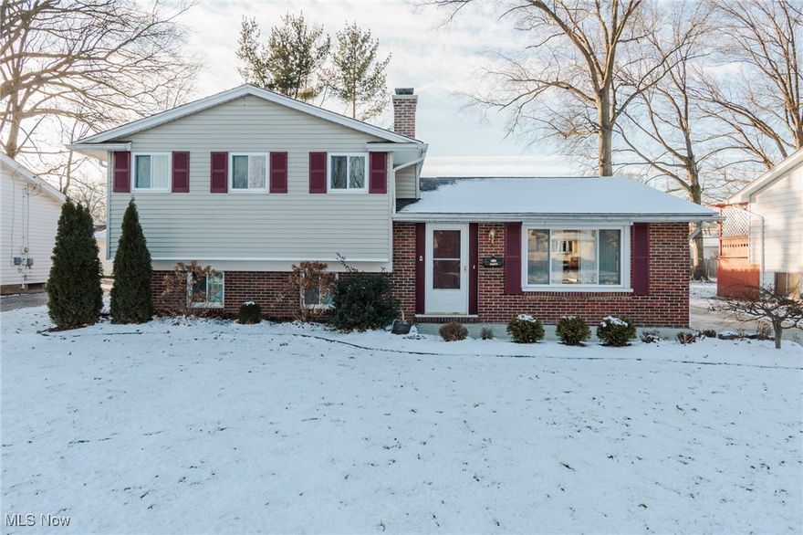 Welcome to this 3-bedroom, 1.5-bath split-level home located in the Deerfield neighborhood. The entry features functional coat hooks and a bench, opening into a main level with an updated kitchen, dining area, and living room. Throughout the home, you will find modern finishes, including updated cabinetry, renovated bathrooms, and recessed lighting. The lower level offers a cozy family room with a wood-burning fireplace, alongside a dedicated laundry, storage, and utility room. Outside, the property features a brand-new roof, a 2-car garage, and a functional backyard complete with a grassy area, a storage shed, and a newer driveway with large concrete pad . Schedule your visit to this move-in-ready home!