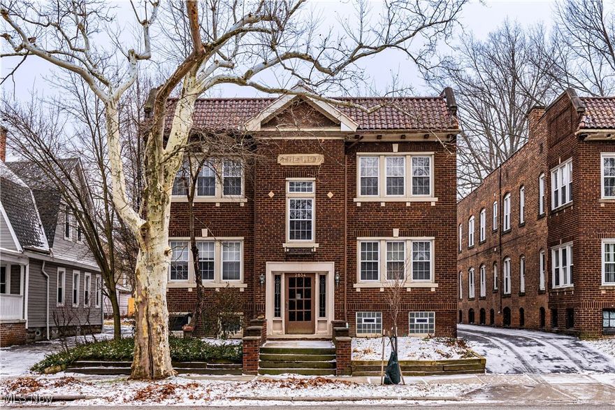 A rare, garden-level residence at The Roy Condo in the heart of Cleveland Heights, set within a charming brick building, this condo has been completely rebuilt from the ground up—literally. Thoughtfully redesigned with modern living in mind, this home features a smart, open-concept layout with well-separated living spaces centered around the kitchen and great room. The interior seamlessly blends original character with all-new construction, highlighted by a striking exposed brick wall that doubles as a stunning art gallery backdrop. Every major system and finish is brand new, including plumbing, electrical, kitchen, baths, flooring, lighting, windows, and central air. Enjoy the appeal of a beautifully maintained building paired with a fresh, modern interior—where timeless charm meets contemporary comfort at The Roy in a prime Cleveland Heights location.