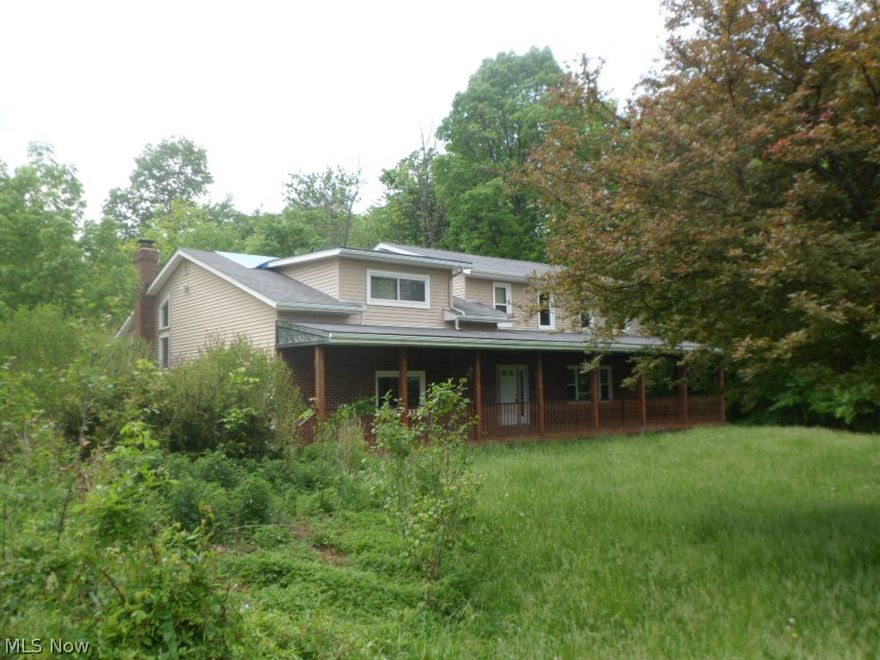 Large four bedroom, 2.5 bath Colonial style home.  Master suite with balcony! Interior has vaulted ceilings and a beautiful spiral staircase! All this is situated on 5 acres of land with a pond and woods! Two car attached garage and also one detached garage! Nice deck, patio and porch to enjoy the outdoor views! Storage shed/outbuilding! Plenty to enjoy! Call now for your private showing!