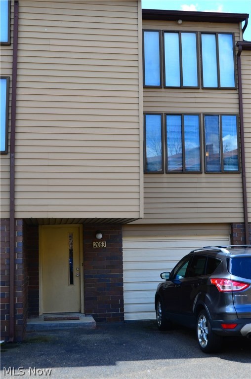 Beautifully updated contemporary condo with an open floorplan and a Loft Bedroom. Conveniently located in Coventry with easy access to highways, golf, metro parks, Portage Lakes, shopping and restaurants. Kitchen recently updated with new stove, dishwasher and garbage disposal, sink, faucet & counter tops, new range hood, luxury vinyl plank flooring. Loft has new carpet, ceiling fan and wall sconce lights. Bath has new vanity, light fixture, toilet along with new faucet & shower head and flooring. New H20 tank and stationary tub in the utility room. All new blinds and professionally painted throughout! The spiral stairs were removed and replaced with a normal staircase and a closet for additional storage. Attached garage, mudroom and laundry room on ground floor level. Why pay high rent when you can own this awesome home? Nothing left to do, just move in and enjoy! Call today for a private viewing
