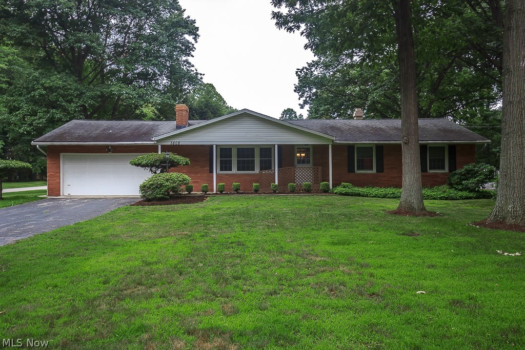 Well-maintained spacious three bedroom, two and a half bath brick ranch on a corner lot in Mentor. The large kitchen has a new dishwasher and steps down to a half bath. The living room is the perfect place to cozy up on those chilly evenings near the wood-burning stone fireplace and has built-ins and carpeting. The quaint, formal dining room has french doors that lead to the family room with large windows on each wall to let in plenty of sunlight and a door that leads to the patio and backyard. Nicely sized master bedroom with attached full bath. Two additional good sized bedrooms with carpeting and hardwood underneath. Wood paneled recreation room and ample room for storage in the finished basement. Attached garage with side entry. Fenced back yard with mature, manicured lawn & shrubbery. A great home in a great location, begin making your memories today! Updates: Hot water tank (2015)