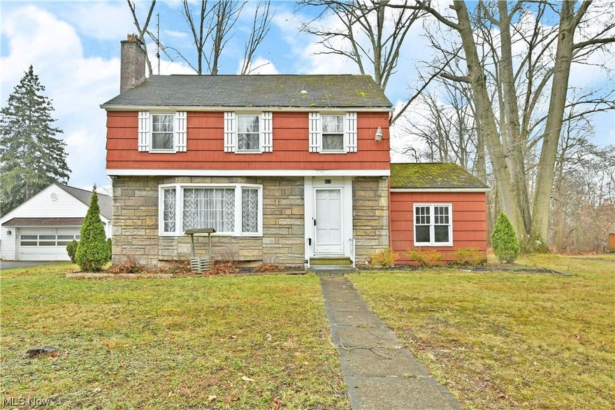 This move-in-ready, three-bedroom Niles home is hot on the market and ready for you to fill it with holiday cheer! The brightly colored exterior is quickly eye catching as it showcases its handsome stonework surrounding a lovely bay window. Attached single-car parking is available from the wrapping driveway as the covered rear patio space overlooks a tree line backyard. Through the stained wood front door, an impressive living room opens from the foyer to reveal its naturally lit footprint and a fireplace at the far wall. Sculpted archways lead into the nearby kitchen and dining rooms. Here, the hardwood-looking tile floor continues underfoot as stone-look countertops include bar-top dining opening to the spacious dining room. Stainless appliances stand out against the dark cabinetry in perfect contrast. Up the carpeted stairway, a prominent landing divides the trio of carpeted bedrooms to include the deep-set master. The two additional bedrooms are nicely sized and offer private closet space. A full bath provides attractive tile work and striking colors to complete the floor. Laundry and storage are located at the basement level.