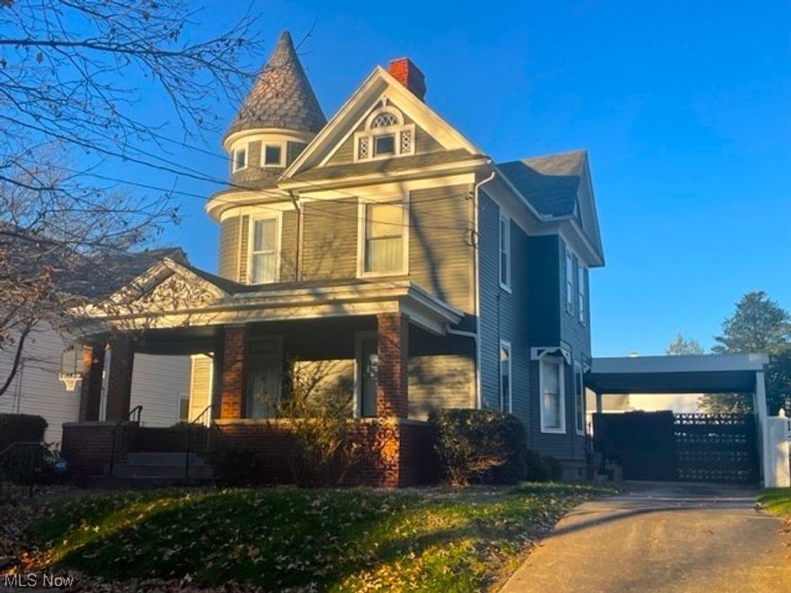 Welcome to 1431 Washington Avenue, a piece of history nestled in the heart of the Parkersburg High School-Washington Avenue Historic District! The district was placed on the National Register of Historic Places in 1992. Sitting elegantly among the lampposts and mature trees lining Washington Avenue you'll find this grand Queen Anne style home with a sweeping front porch. Featuring a unique blend of frame and brick construction, a distinctive turret with fish scale shingles and a conical roof, the property is overflowing with character and charm. 
The seller has lovingly cared for this fine home which boasts gorgeous woodwork, built-in cabinetry, lovely pocket doors, decorative & gas fireplaces and vintage lighting! The first floor features a large foyer, spacious living room and formal dining room, an updated kitchen with a large island and appliances, an updated laundry room with stackable washer & dryer and additional cabinetry, and a small bedroom with an attached full bath with walk-in shower. There are front and rear staircases to access the second floor which adds three additional bedrooms and an updated bath with tub & shower. The unfinished walk-up attic can be accessed from the smallest bedroom. The furnace, water heater and breaker box are located in a partial basement accessed from the laundry room. Paved driveway and carport provide off-street parking and protection from the weather. The ample backyard is level & fenced for privacy including a shed for storage.