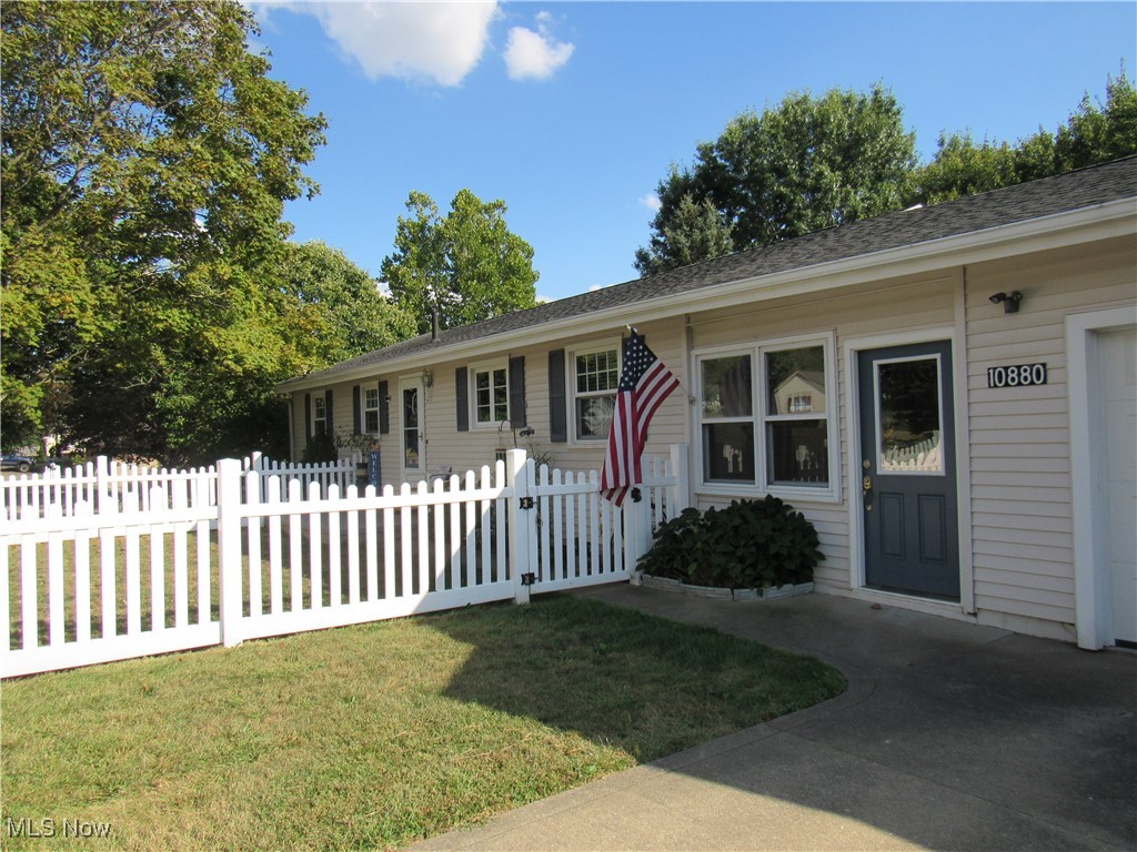 Charming Ranch with Walkout Basement in Tuslaw Schools
Welcome to this delightful ranch home situated on the outskirts of Massillon in Tuscarawas Township, located in the desirable Tuslaw School District. A darling white picket fence greets you at the front yard, setting the stage for the warmth and character this home offers.
Step inside through the enclosed breezeway or the main front entry with foyer and hallway. The spacious eat-in kitchen is well equipped with appliances, abundant countertop space, ample cabinetry, and a pantry. The large living room showcases an amazing picture window that frames scenic views in every season. All three bedrooms offer generous closet space and plenty of natural light, creating comfortable retreats throughout the main floor. Relax in the beautifully updated full bath with a stand-up shower.
The partially finished walkout basement expands your living space with a 40' x 12' recreation room showcasing a cozy fireplace and a wall of windows. This versatile space includes a carpeted area (26' x 12') and a laminate hardwood section (14' x 12'), making it ideal for a media room, game space, or entertaining. A second full bathroom with a stand-up shower completes the finished portion. The unfinished area offers a laundry room, well water room, and all mechanicals.
Step outside to your covered porch and enjoy a backyard designed for gatherings. The upper level of the yard is perfect for play or relaxation, while the spacious lower yard invites family fun—whether it’s baseball, football, bonfires, or more. As a bonus, the property backs up to the Towpath Trail, perfect for walking, running, or biking right from home.
Car enthusiasts will love the oversized 2-car garage, offering plenty of room for vehicles, tools, and projects.
This property combines country living with convenient access to Massillon and nearby amenities. Don’t miss your chance to make it yours!
