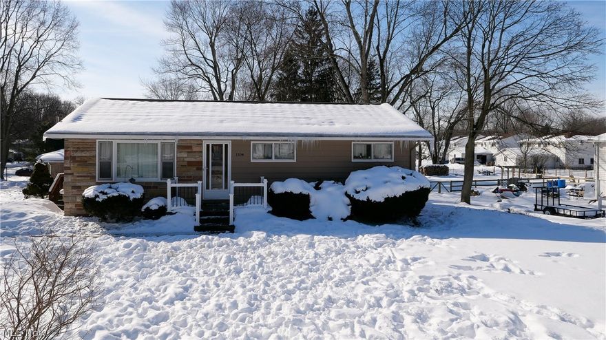 Updated 3 bed/ 1 bath home located in Kent Local School District. Home sits on a corner lot, and has a blueberry bush that produces enough blueberries to feed the block! Luxury Vinyl Plank Flooring (2019) extends throughout home. Large living room with new paint leads to the remodeled kitchen (2020). Nothing was left out when designing this kitchen. The built in pantry provides ample storage. Pull out shelves and  built in spice rack add to the convenience. Quartz counter tops and a composite sink complete the remodel. The bath has been remodeled as well with new  vanity, tub surround, and toilet. 3 bedrooms round out the first floor. The basement is dry and could be finished to add living space. The current owner roughed in and framed a full bath, drains and plumbing are completed for the shower, sink  and commode. Do not  miss this gem!