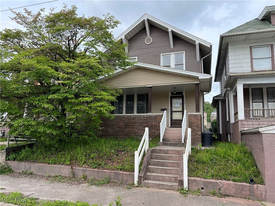 HUD Home Selling AS-IS. The first floor has a formal foyer, a living room with a fireplace, a dining room, an updated kitchen, a full bathroom, and one bedroom. The second floor consists of three bedrooms and a full bathroom. The basement is unfinished. Outside, the home has a covered front porch and a back deck with a retractable awning.