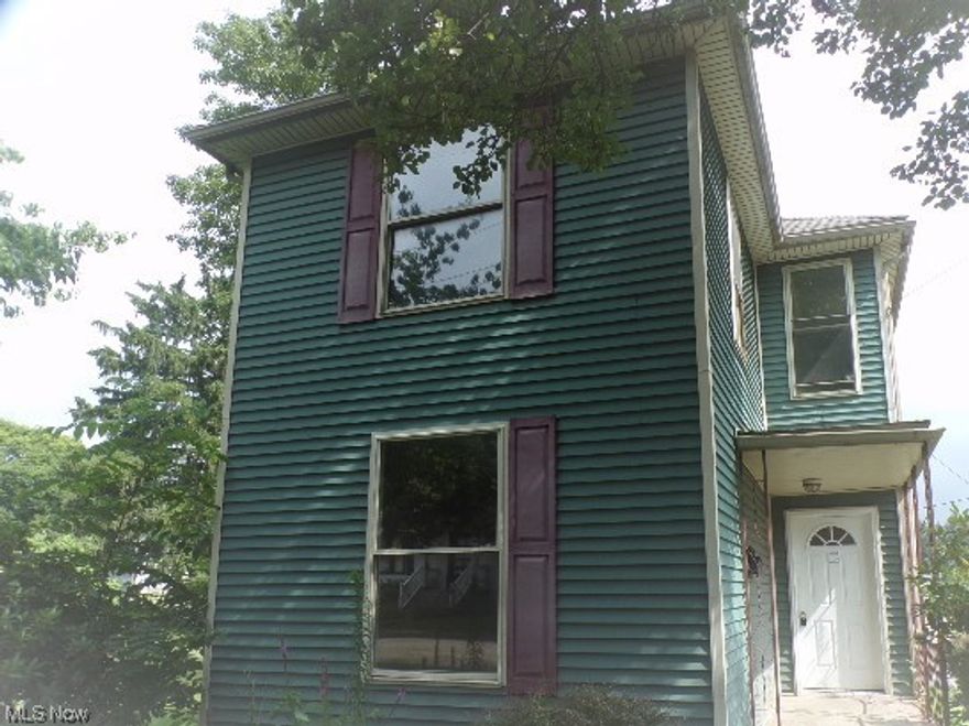 Two Story in town on large corner lot with nice deck overlooking backyard! Home features - 1.5 baths, three bedrooms,  nice kitchen, full basement, in town with public utilities!