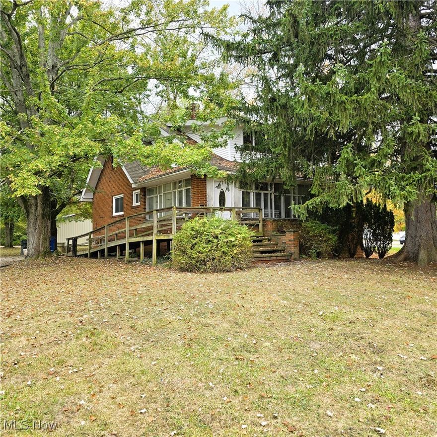 Be first or be sorry! Immediate possession! Four bedroom Cape Cod on over 6 acres! Eat in kitchen. First floor laundry room. Main bath updated approximately 5 years ago. Formal dining room with built-in cabinets and window seat. Big living room with double french doors leading to a home office and 3 season sun room. Three bedrooms with big closets on the second floor. Big glass block windows in the basement. Updated electrical panel. Updated furnace. Absolutely beautiful yard! Huge 40x30 out building built in the early 2000's. Must see! Country living in the city but near all city conveniences! Hardwood floors under some carpeting. Includes one year home warranty!