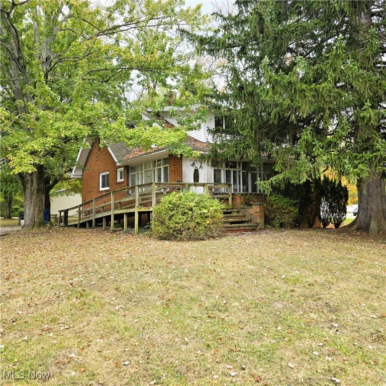 Be first or be sorry! Immediate possession! Four bedroom Cape Cod on over 6 acres! Kitchen updated 2025. First floor laundry room. Main bath updated approximately 5 years ago. Formal dining room with built-in cabinets and window seat. Big living room with double french doors leading to a home office and 3 season sun room. Three bedrooms with big closets on the second floor. Big glass block windows in the basement. Updated electrical panel. Updated furnace. Absolutely beautiful yard! Huge 40x30 out building built in the early 2000's. Must see! Country living in the city but near all city conveniences! Hardwood floors under some carpeting. Includes one year home warranty!