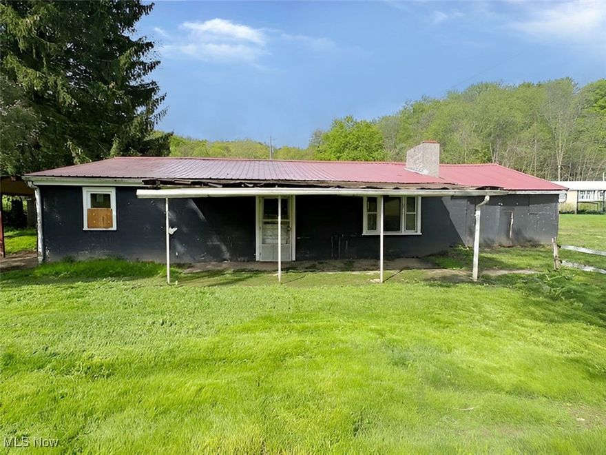 3 bedroom 1 bath ranch on slab on almost an acre lot. Picturesque setting with a creek running through the property. Great place for chickens and ducks.