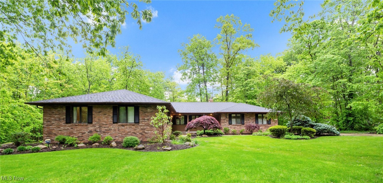 Beautiful quality-built ranch in a lush green wooded setting with stunning views. Features spacious living areas, two fireplaces, Anderson windows, a covered porch, 3 bedrooms, 2 full and 2 half baths, and a walkout basement. The built-in 3 car garage has added room for storage. The large concrete driveway provides ample room for the vehicles of guests—you will be able to park multiple vehicles. The Generac generator brings peace of mind because it is capable of providing power to keep most home systems
and appliances working in the event of a power outage. The partially finished 2042 sq. foot basement has the same perimeter shape as the 1 st floor. It has a finished ½ bath. This area provides ample space for your hobbies, additional “set apart” space, and has moveable open storage shelves which are fairly sizeable. Peaceful and private, this home offers comfort, character and considerable room to make it your own.