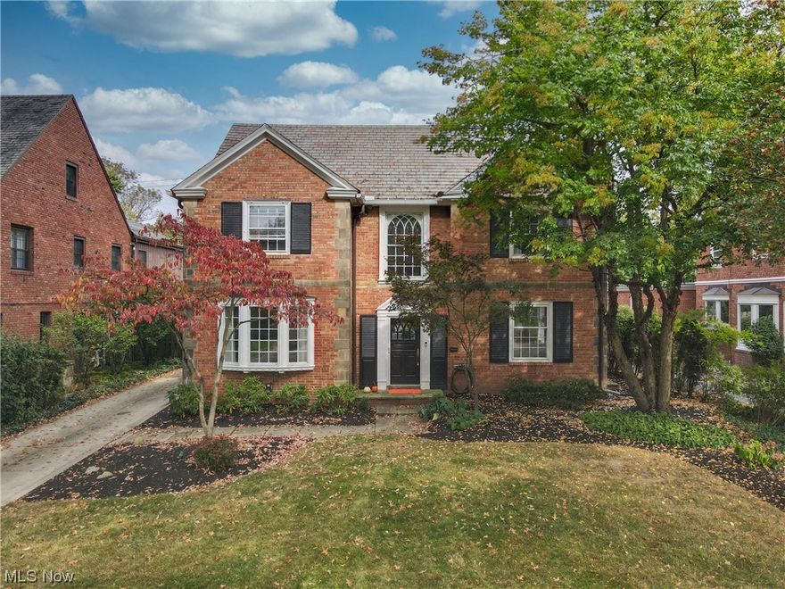 Welcome to this stately brick home nestled on a beloved tree-lined street in Shaker Heights! The brick exterior, fresh landscaping and beautiful Palladian window open to front entrance. Step inside, and you'll be greeted by the grandeur of this residence. The spacious living room boasts a cozy gas fireplace and seamlessly leads into the all-season room, perfect for enjoying the changing seasons year-round. The dining room is adorned with a beautiful bay window that floods the space with natural light. Fully updated kitchen includes loads of cabinet space, massive center island with seating, stainless steel appliances and oversized farm sink w picture window. For those who need a dedicated workspace, there is a private first-floor office that offers a quiet retreat for productivity and concentration. The second level includes three bedrooms and two full baths. The owner’s suite features two closets, beautiful hardwood floors and en suite bath. The two additional bedrooms share a fully renovated jack and jill style bath. Venture up to the third floor, where you'll discover two more bedrooms and another full bath. Closets inside the bedrooms and in the hallway provide plenty of storage options, making this level perfect for extended family members, guests, or a playroom. Partially finished lower level with bar is the perfect multi-purpose space. Outside, the backyard is a peaceful oasis, featuring a delightful patio and green space. Don’t miss the opportunity to view this home!