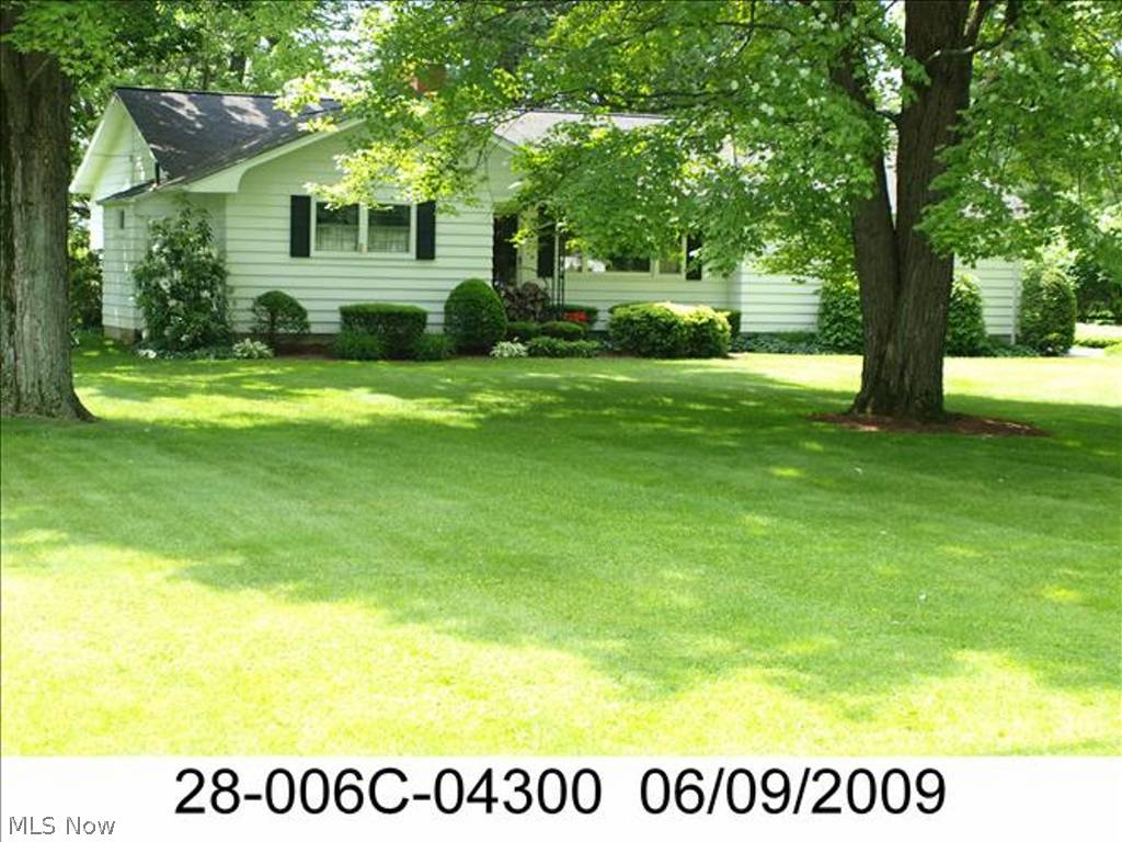 Lovely, beautifully maintained 3-4 bedroom ranch in Howland on almost one acre lot. Two full baths. Formal living room with wood-burning fireplace, dining room, bright kitchen with eating space, hardwood floors under carpet in 3 bedrooms. Finished family room with gas fireplace in basement, also rec room, laundry room, and workshop. Two-car garage with basement access and access to year-around, heated Florida room overlooking gorgeous deep backyard. Freshly painted inside and out. A+ condition with little to do but move in and enjoy. All appliances stay.