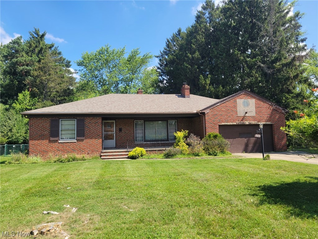 Opportunity is Knocking! Welcome all potential Buyers, Investors, or Flippers! This solid brick sprawling ranch offers large square footage, a full basement, and one the most spectacular lots you have ever seen in this area. The backyard is completely fenced in, it's wooded, and it's BIG...100x317 ft. As you enter, the home offers a large living room with a fireplace and dining room, both with hardwood floors underneath the carpet. The French glass doors lead to a three-season sun porch off the dining room. The kitchen is a good size, with a closet you can turn into a large pantry. All bedrooms are generous in size and have spacious closets and real hardwood underneath the carpet. There is tons of closet space too. The first floor offers 1.5 bathrooms. Let's not forget the lower level. A sprawling ranch lower level is the entire footprint of the home, that's doubling your square footage. The lower level has a partially finished Rec room with a fireplace, along with other spaces/rooms