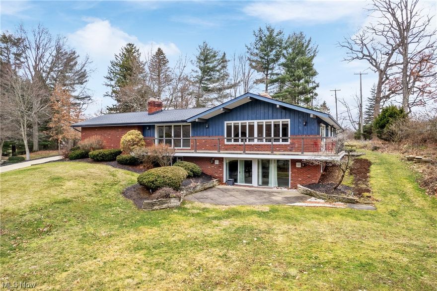 This thoughtfully designed contemporary ranch offers a seamless blend of luxurious comfort that's perfect for both daily living and entertaining.  The heart of the home is its gourmet kitchen, equipped with high end stainless steel appliances including a convection cooktop & wall oven.  Ample storage is provided by a spacious walk in pantry, while beautiful cabinets, granite countertops and a breakfast bar elevate the space.  Distressed cherry hardwood floors extend from the kitchen to a cozy adjacent space anchored by a stone fireplace and sliding doors leading to a wrap around balcony promising endless views and natural light.  The formal dining and living rooms, adorned with vaulted beamed ceilings, offer a sophisticated open space and are further complemented by access to the expansive deck.  Private hallway leads to full bath, 3 bedrooms, primary suite and laundry area.  All baths have been designed with high-end fixtures and finishes.  Venture downstairs to the walk-out lower level designed for gatherings.  Here an expansive rec room with fireplace provides easy access to the outdoor patio while the spacious workout room provides endless possibilities...and of course, the 16x30 salt water pool.   Recent upgrades include: septic tank (18) new 50 yr roof & painted exterior(19), pool switched to saltwater, painted/sealed, new pool pump (22).  Although this property is being sold as-is, it presents an incredible opportunity for those who appreciate the allure of the unparalleled Village of Hills and Dales.  This is an exceptional find for those who appreciate incredible opportunities.