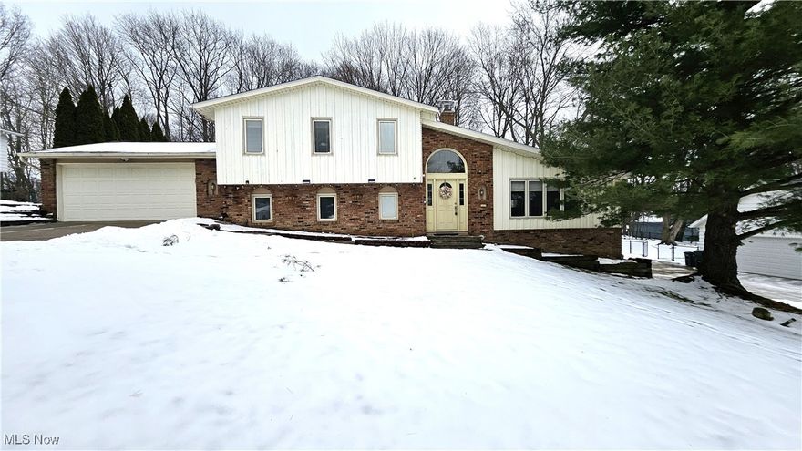 Located in North Solon, this 4-bedroom, 2-bath split-level home offers a private backyard and a walk-to-everything lifestyle, including nearby schools and a playground. Hardwood floors span the living room, dining room, and two bedrooms. A fourth bedroom or home office is conveniently located on the main level, adjacent to a full bath—ideal for guests or remote work. The kitchen features ample cabinetry and granite countertops and opens to an oversized family room with wood-laminate flooring. A sliding door from the eat-in area leads to the deck and backyard, perfect for indoor-outdoor living. The second level offers three generously sized bedrooms and a full bath, including direct access from the primary bedroom. The lower level is partially finished with a recreation room and additional storage space. The home is offered partially furnished and includes all appliances, washer and dryer, lawn mower, and snow blower for tenant use. Available immediately.