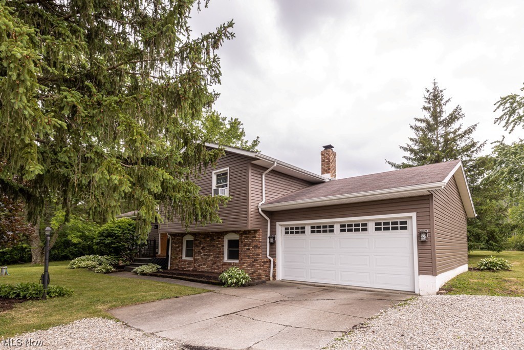 Recently updated home in Cloverleaf school district 10 mintes from downtown Medina. This split level home offering 4 bedroom 2 bath, offering 2.1 acres large backyard, attached garage, large patio and more. This home offers a large media/entertainment room on the 1st floor with sliding patio doors leading to rear patio. Home has 1st floor bedroom and full bath. Basement offers washer and dryer area with extra storage. Large living room and formal dining area with eat in kitchen and lots of cabinet space. Upper floor features 3 additional bedrooms and second full bathroom. Large driveway and away from the road and still offers large open backyard with woods behind. Attached 2 car garage with added door for rear yard access. Aggressively priced for quick sale.