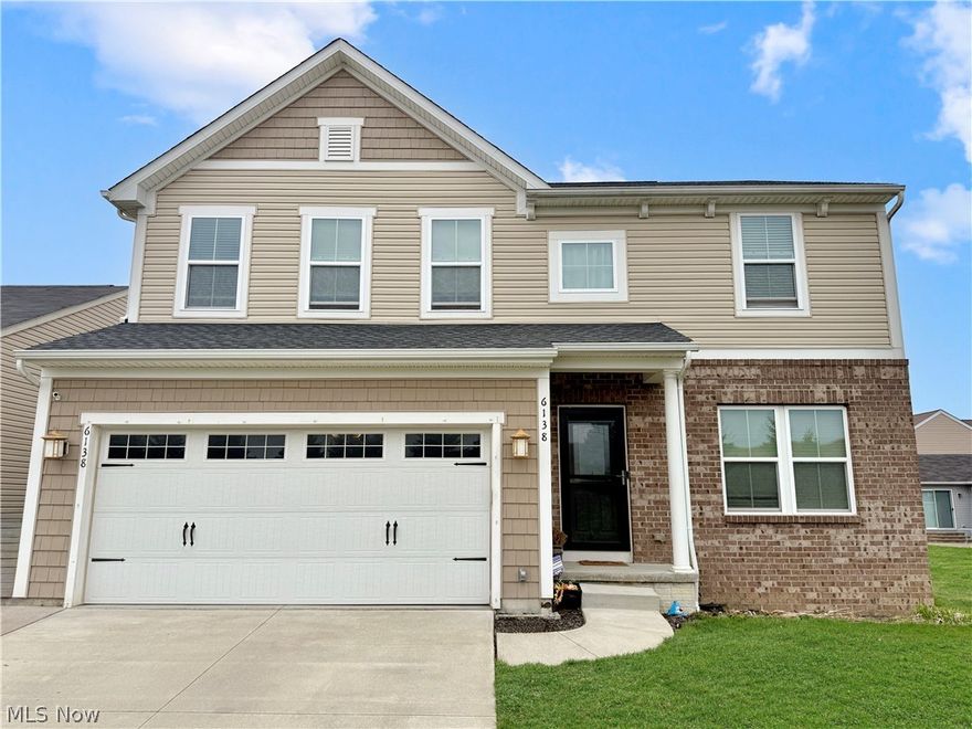 Welcome home to this beautifully maintained open-concept Colonial in Lorain, offering 3,436 square feet of thoughtfully designed living space. This spacious residence features 4 generously sized bedrooms, 4 bathrooms, and a functional layout ideal for both everyday living and entertaining. The recently finished full basement provides additional living space, complete with a bonus room and full bath, perfect for guests, a home office, or recreation. Enjoy ample parking with a paved driveway and an extended two-car garage. Conveniently located near shopping, dining, and everyday amenities, this home also offers access to a community pool, ideal for summer relaxation. Don't miss your opportunity to tour this exceptional home. Schedule your private showing today!