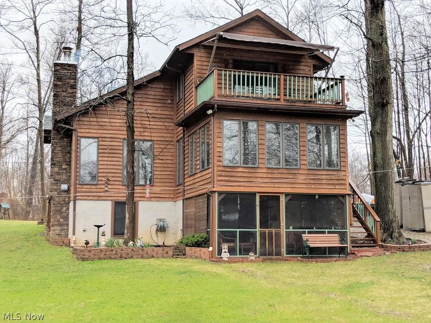 Lake view from almost every room. Waterfront with your own dock, patio/fire-pit in large back yard. Spacious home with 4 season sun-room, lower enclosed patio and upper deck with awning off the master bedroom all overlook lake. Fully equipped kitchen, wood fireplace, very well maintained. Updates: 2017-Roof, water heater, sump pump. 2016-cedar re stained. You will love the insulated heated attached garage with work area, 2 laundry shoots, walkout basement and the stacked firewood can stay!