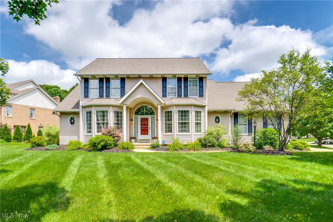 We're thrilled to introduce you to this stunning home! Welcome home to 6603 Oakbridge! Nestled on a corner lot in a quiet neighborhood, this Jackson LSD colonial features four bedrooms, 3.5 baths, and a first-floor laundry! From the front door, enter the foyer with the living room to your left and the dining room to your right. Continuing down the hall, you'll find a large great room with a fireplace and high ceilings. Off the great room is the dinette area open to the kitchen and laundry room. In the kitchen, you'll find gorgeous countertops, ample cabinet space, and newer flooring. The laundry room features ample extra cabinet space, along with a sink. The first-floor master suite is plenty spacious and comes with its master bath. The master bath boasts two sinks, a garden tub, and a shower. Completing the main floor is the half bath with a single vanity. Upstairs, find three more spacious bedrooms with ample closet space. The hall full bath features a vanity with two sinks and ample cabinet space. The basement is partially finished with a rec room, and the unfinished side provides a workshop area. The exterior features beautiful landscaping, a 3-car attached garage with a circular driveway, and a rear deck. Additionally, the home is conveniently located across the street from Kent State and Stark State, and is just minutes away from the heart of Belden Village and major highways. Don't miss your chance to see this beautiful home; schedule your showing today!