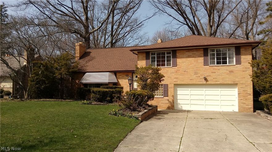 Incredibly spacious split level home with a basement!  Beautifully remodeled kitchen!  Newer roof and water heater!  Updated furnace and Central Air!  Large screened in gazebo overlooks a spectacular treed lot and view!