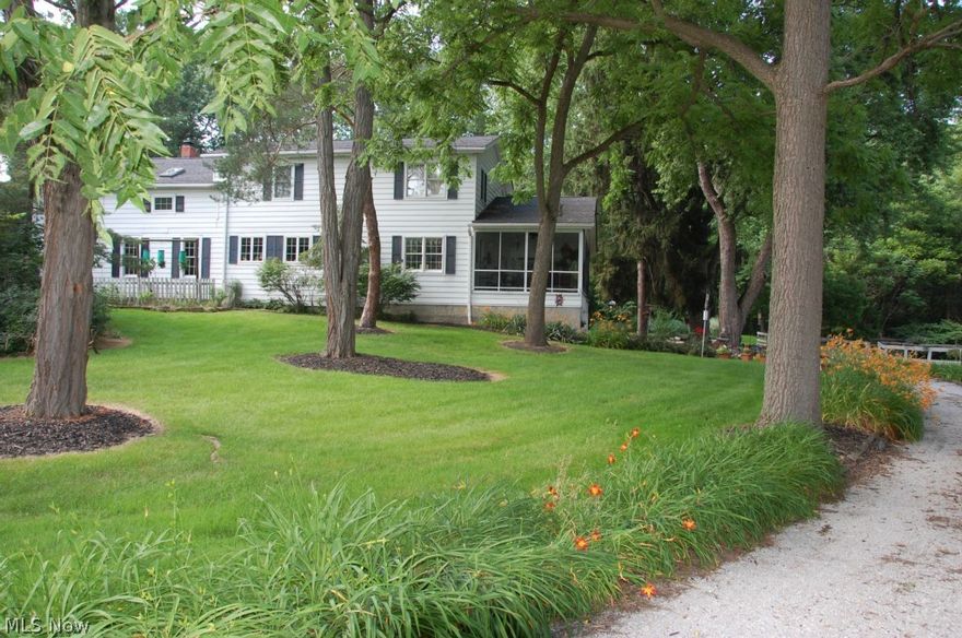 Prepare to be awestruck by the quality & beauty of this century home that sits on 5 acres and includes a 2 stall horse barn.  Every room is filled with charm and character as the owners were careful to preserve the home with excellence & tasteful décor throughout.  Take note of the spacious rooms: the formal living room is 29 x 14 with a Vermont Castings wood stove, wall of built-in bookshelves plus sliders to the 34 x 13 screen porch. A French door  style doorway leads to the 21 x 15 country kitchen with  wood plank floors,cream cabinets & granite counters, tiled backsplash,huge island w/ stools. The kitchen  opens to the breakfast room or the formal dining room. There is also a den with more built ins, a first floor laundry and a first floor bedroom with full bath.  Two staircases lead to the second floor where you'll find the 26 x 15 master suite with plenty of closet space,a private master bath with shower and jetted tub, a  private office, 2 more guest rooms and a third full bath.