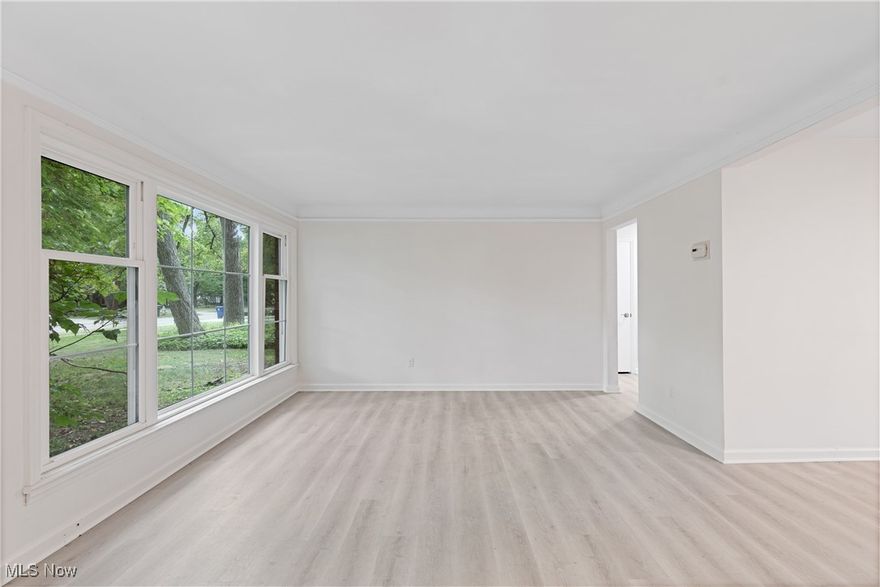 Must See to Appreciate as this home is much bigger than it looks!  Welcome to 1057 Renfield Rd, a charming Cape Cod-style home nestled in the heart of Cleveland Heights. Boasting over 2,100 square feet of light-filled living space, this home offers the perfect blend of modern updates and timeless charm.

Step inside to discover brand-new LVT flooring throughout, providing a fresh and contemporary feel. The spacious living room and dining area create an inviting atmosphere, perfect for gatherings. The updated kitchen features sleek finishes, making meal prep a breeze. Just off the kitchen, you’ll find a vaulted library/study room, a unique space ideal for working from home or relaxing with a good book.

This home offers flexibility with 3 bedrooms, including 2 on the first floor, and a bonus recreation room that can easily be converted into a 4th bedroom. Both bathrooms on the main level have been fully updated, and a convenient first-floor laundry makes everyday chores easier. Upstairs, a cozy bedroom and an additional half bath provide added privacy.

Outside, the large fenced-in backyard offers plenty of space for entertaining, complete with a patio and surrounded by mature trees that provide privacy and a peaceful, nature-filled atmosphere.

Located in a desirable Cleveland Heights neighborhood, you're just minutes away from University Circle, Metroparks, shopping, playgrounds, and schools. Ideal for first-time homebuyers or growing families, this home is priced to sell and qualifies for down payment assistance. With its modern updates and ample space, 1057 Renfield Rd is ready to welcome you home!

Don’t miss the opportunity to make this beautiful property yours—schedule a showing today!