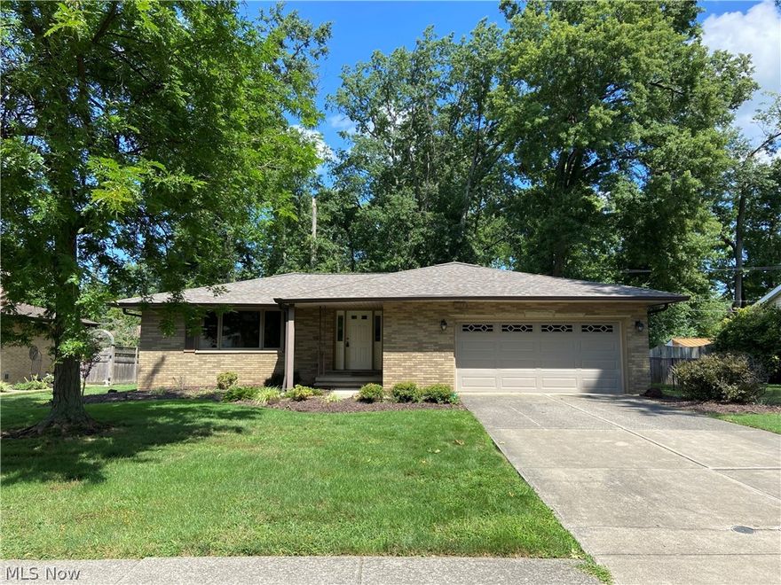 Explore the potential of this charming, original owner 3 bedroom, 1.5 bath brick ranch! Located on a quiet neighborhood street in Seven Hills. The private, fenced-in back yard features wooded views and gate access to John Glenn Park, offering a large playground, tennis courts and soon-to-be-built pavilion. Tiled entryway flows into the living room/dining space featuring original hardwood floors that continue into the bedrooms. The well-maintained kitchen sits at the heart of the home including newer stainless steel appliances. Step down into the cozy, wood paneled family room featuring built-ins for extra storage. Partially finished basement with generous square footage is easily tailored to your lifestyle with space for everything from a rec room to a home office and more!
Roof replaced in 2014. Garage door and opener replaced 2017. Air compressor 2015. Electrical box replaced 2018. Includes a Rain Bird sprinkler. Hardwood floor under carpeting in bedrooms. Owner moved laundry hookup