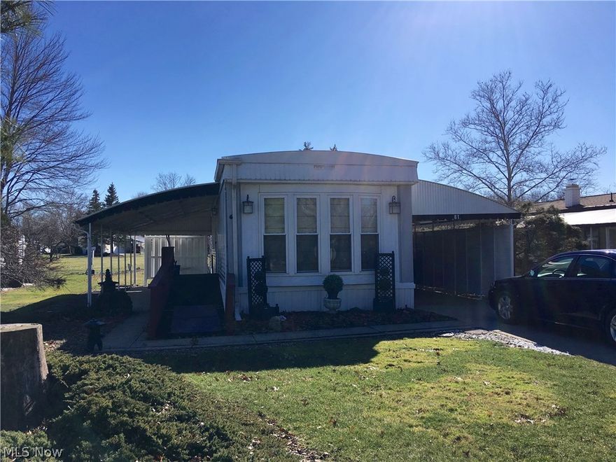 Large eat-in kitchen, all appliances stay.  Breakfast bar, lots of cupboard and counter space.  Built-in sound system.  Large bath.  Master bedroom with built-ins.  Covered carport and patio.  New Haven model.  55+ community.  Pet restrictions.