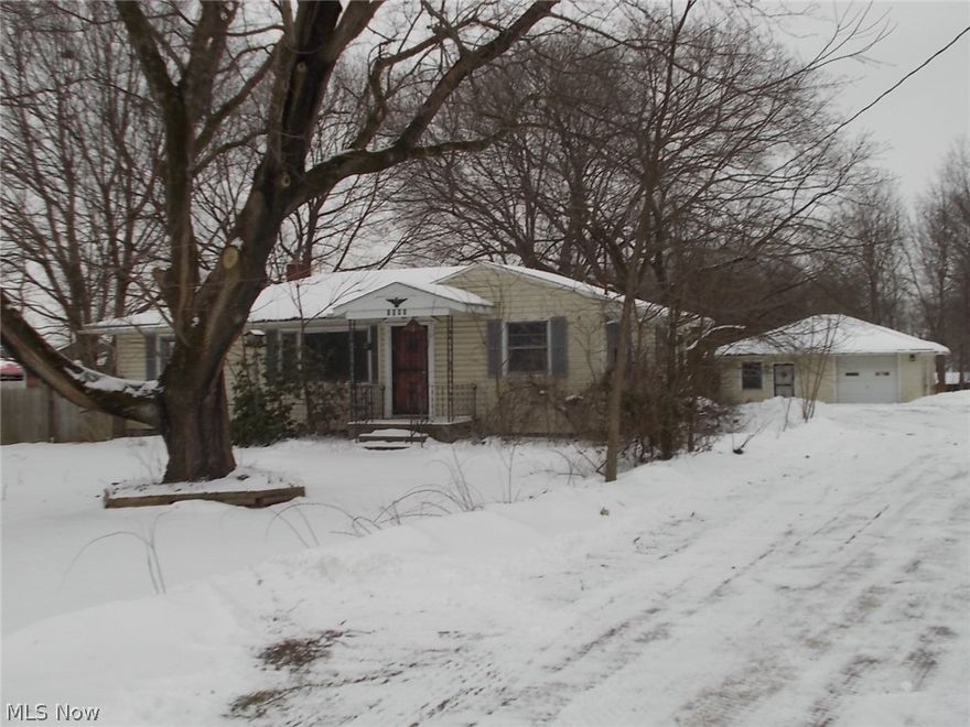 Amazing opportunity here in this 3 bedroom Ranch resting on a deep 2 acre lot in desirable Suffield Township!! Property needs repairs and TLC but offers incredible potential to investors looking for their winter project. Home features a large sunroom offering beautiful views of the wooded and fenced back yard. A perfect peaceful retreat with a expansive deck for enjoying the seasons and entertaining. Plenty of storage, counter space, and function in the kitchen leading into larger dining room. Spacious living areas and attractive floor plan... third bedroom on the lower level is large enough to be a great recreation room! The detached garage adds significant additional storage or work space as well as electric and water! Field Schools! Don't miss your opportunity to take advantage of the potential offered at this property and its large 2 acre lot!! Make your appointment today!