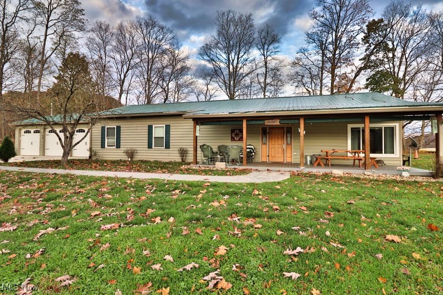 Cross Reference Property Listing # 5183196.  House, outbuildings and pond on 10+/- acres List Price of $575,000.   The 51+/- acres to be purchased separately with list price of $714,000.  May be purchased together at $1,289,000.  Wooded acreage and building site has it's own listing number of 5183196.   Beautiful country setting featuring three bedroom, two bath home (barndominium style) situated on 10+/- acres with a two-acre fully stocked, spring-fed pond. Metal roof, propane forced air heat and central air.  Pure tranquility sitting on the front porch overlooking the pond which features a multi-colored water fountain.  Detached insulated heated pole building 32x42, with small kitchen area with triple stainless steel sink. Also, a 36x32 open ended metal building with lean-to. Hookup for large camper.  Excellent water supply.  Septic tank and 600+/- foot leach bed.   Cement pad for camper with electric hookup.  Video cameras on property.  $2 per year.  Muskingum Water Conservation District fees included in tax bill. This property can be purchased separately or together.   Must be surveyed .Call Listing Agent for details.  10+/- acres home and outbuildings listed at $575,000 and 51+/- wooded acres, building site, creek list price of $714,000.  Property must be surveyed for split.  Coshocton County lead the State again this year with highest deer harvest of 8,527 deer tagged.  This is 24 years straight!The top 5 counties this season, per ODNR data, were:

Coshocton: 8,527 (Coshocton County has led Ohio in the number of checked deer 24 years in a row. Last season, hunters in Coshocton County tagged 8,196 deer.)
Tuscarawas: 7,623 
Ashtabula: 7,161 
Knox: 6,704
Muskingum: 6,283