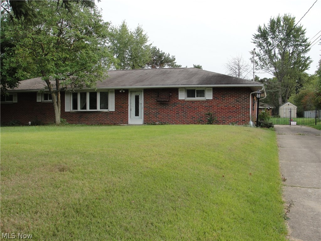 Nice Brick Ranch On Quiet Street . Large Family Room With Stone Fireplace With Office Built-Ins & Skylight. Walk Out To Large Private Lot. Great Utility Room & Storage In Garage Plus Outbuilding!
