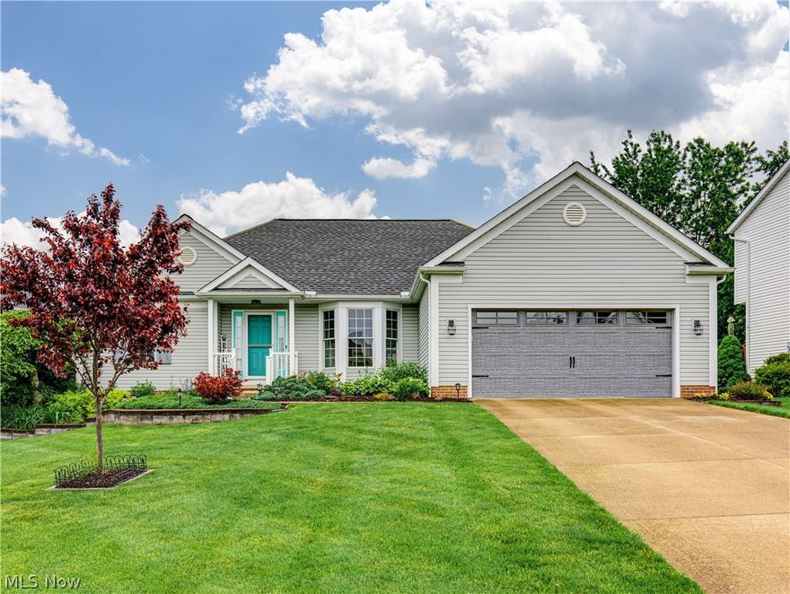 Welcome to Glenbreigh Estates in Barberton, OH! This charming ranch-style home offers 3 bedrooms and 2 full bathrooms with 1,774 sqft of above-grade living space, providing easy 1-floor living. Step inside and you’ll immediately notice the beautiful original hardwood floors that run throughout the spacious great room and eat-in kitchen. With high cathedral ceilings, skylights, and a beautiful stone gas-log FP, this space feels bright, open, and comfortable. The great room flows right into the eat-in kitchen, which features oak cabinets, quartz countertops, newer stainless steel appliances, a breakfast bar, and a dedicated dining area. From there, sliding glass doors lead out to the back deck, which has been updated with low-maintenance Trex-style decking including a gazebo and a porch swing. Just off the eat-in kitchen, you’ll find the formal dining room, filled with natural light and accented with chair rail molding and a chandelier. The spacious primary suite is privately located just off the eat-in kitchen and features a fully updated en-suite bathroom. The bath includes a his-and-hers vanity and an oversized walk-in shower, offering a clean, modern feel. Two generously sized bedrooms are located on the opposite side of the home and share a full bathroom. The main level also includes a convenient laundry room with access to the two-car garage, which features a sink with hot and cold water along with an exterior access door.The unfinished basement offers plenty of potential with12-course height walls, ample storage space, and a dedicated workshop area. It’s a great blank slate whether you’re looking for extra storage or future finishing options. The neighborhood is very inviting and features sidewalks throughout, making it great for evening walks or just getting out and enjoying the area. Updates include: Furnace, A/C, Roof, and Skylights(Approx. 2 Years Old), and a newer HWT. Don’t miss your chance to own this beautiful home within Glenbreigh Estates.