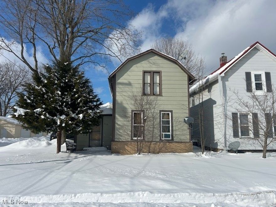 Charming 3-bedroom, 1-bath home with great bones and tons of potential. Features include a first-floor bedroom and full bath, with two additional bedrooms upstairs. The welcoming foyer/multi-use entry overlooks the living room and includes a cozy wood-burning stove. Outside, you'll find a detached mechanics dream garage complete with a pit, plus an additional single-car garage/workshop located at the rear of the property. A semi-finished outdoor kitchen adds extra entertaining potential. With a few small upgrades, this home could truly shine or make an excellent rental property. Schedule your private showing today!