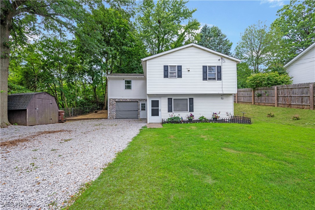 Don't miss the opportunity to own this cozy raised ranch located in Springfield Township! This 3 bed 2 full bath home features an open layout, large sprawling bedrooms, and lots of space to let your imagination run wild. The spacious open kitchen with a large island offers ample cabinet and countertop space and flows seamlessly with the open living space. Two spacious bedrooms and a well appointed full bath round out the main floor living spaces. On the lower level you will find an additional bedroom, a full bath with a large built in soaker tub and laundry area, and an additional living area that can be used as a flex room or additional living room. The large extra wide driveway offers loads of parking space, and the large front lawn has been made into a private oasis with privacy fence and greenery. This home won't last long. Schedule your showing today before it's gone!