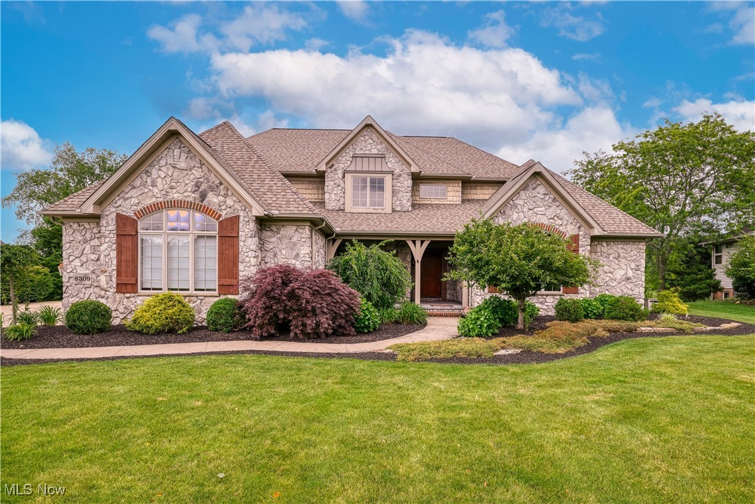 This exquisite home and property are absolutely amazing! You will find unsurpassed quality, attention to detail, exceptional workmanship and amenities and so much more in this gorgeous home. Stunning kitchen with large island with eating bar, all appliances and pantry, beautiful family room with stone fireplace, charming dinette, formal dining room that is perfect for entertaining or family gatherings , two story living room with fireplace, very spacious first floor den. The first floor owners suite is complete with a huge walk-in closet and a luxury bath with double sinks, whirlpool tub and tile shower. The walk-out lower level features a large rec room, built in bar with beautiful cabinetry, a dining area, a wine cellar, a bedroom with walk-in closet and a full bath. There is also plenty of space for storage here. The .93 acre backyard is a private oasis! It has a stamped concrete patio, a covered patio, a waterfall, a fire pit and a gorgeous water view. Updates include a new roof (2019), tankless water heater (2024), furnace and central air conditioning (2016), garage doors and garage door openers (2022), remodeled primary bath (2017), deck (2024), and granite counters and Delta faucets in three bathrooms (2021). Call today to see this magnificent home!