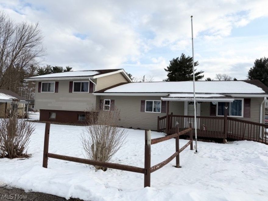 Located just 10 minutes from downtown, this solid bi-level home offers the perfect blend of a rural setting and convenience. Situated on 4 parcels totaling 0.88 acres, the property features a nice, flat yard with plenty of room to enjoy the outdoors. There is also a block building that was formerly the old co-op store. What could YOU do with this building? It's been used as a large storage area in recent years. Inside, you'll find 4 bedrooms, one being on the main floor and a 5th in the basement, offering flexibility for guests, a home office, hobby room, home gym, or just additional living space. With close to 2000 sq. ft., Ft there is room here for everything. While this property needs some cosmetic updates, it presents a wonderful opportunity to restore it to its former charming family home. With reasonable property taxes and no city income tax, this home offers both value and potential in a peaceful setting in Midway. AGENTS SEE PRIVATE REMARKS