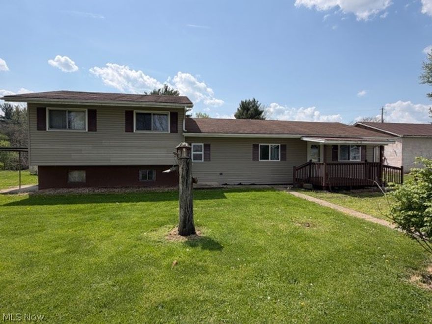 Located just 10 minutes from downtown, this solid bi-level home offers the perfect blend of a rural setting and convenience. Situated on 4 parcels totaling 0.88 acres, the property features a nice, flat yard with plenty of room to enjoy the outdoors. There is also a block building that was formerly the old co-op store. What could YOU do with this building? It's been used as a large storage area in recent years. Inside, you'll find 4 bedrooms, one being on the main floor and a 5th in the basement, offering flexibility for guests, a home office, hobby room, home gym, or just additional living space. With close to 2000 sq. ft., Ft there is room here for everything. While this property needs some cosmetic updates, it presents a wonderful opportunity to restore it to its former charming family home. With reasonable property taxes and no city income tax, this home offers both value and potential in a peaceful setting in Midway. AGENTS SEE PRIVATE REMARKS