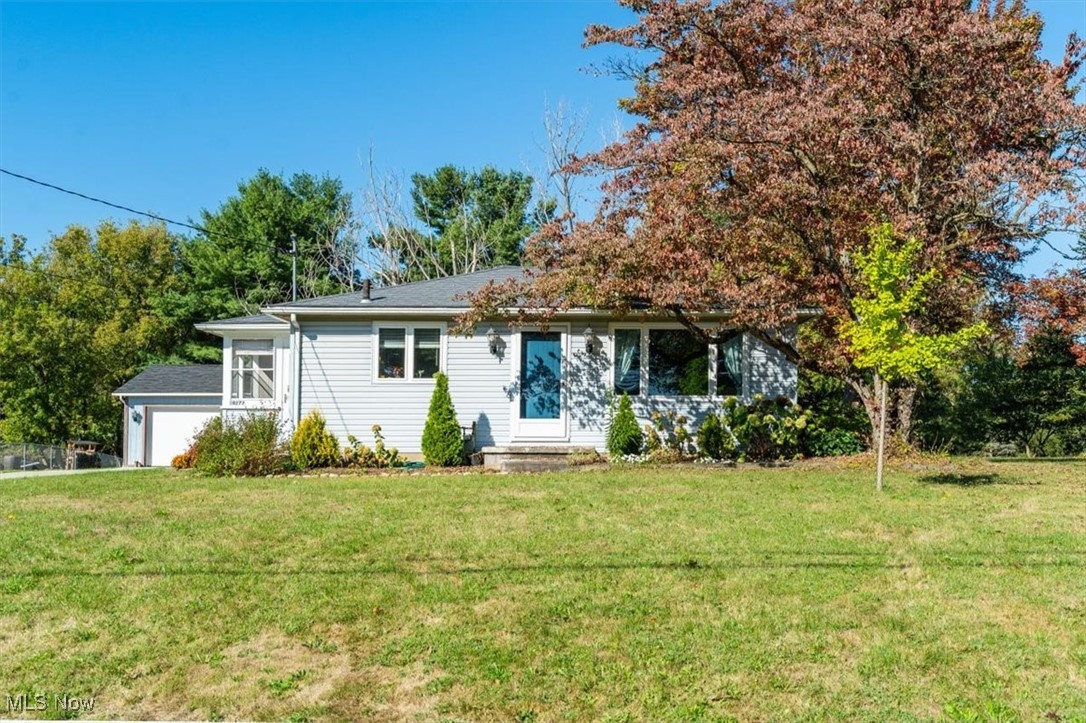 Adorable two bedroom, two bathroom home in Lake Local Schools on .75 acre lot. The living room offers hardwood floors, and plenty of natural light. An updated kitchen with maple cabinets, glass tile backsplash, and all of the appliances stay. One of the bedrooms has custom whimsical murals painted on the walls. The other bedroom offers a walk-in closet, cathedral and beamed ceiling, and a sliding glass door to the deck and back yard. The lower level is finished with a second bathroom, a kitchenette, and a recreation room. This space would be a perfect an in-law suite, or teen suite. Private backyard! Three car detached garage. Many updates include windows, sliding glass door, lower level bathroom, water softener, well pressure tank, microwave, washer, overhead garage door, and concrete drive.