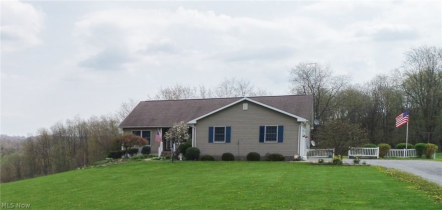 This lovely ranch country home offers all that you are searching for! Featuring four bedrooms and three baths. Situated on the high point of the property the view is of a gently rolling yard and forest. The kitchen conveniently opens to the living room with a raised breakfast bar that comfortably seats four. With plenty of cabinets and open concept this home has more than enough room for your family to gather together to prepare meals.  A beautiful stone fireplace warmly welcomes you to the living room with a picturesque view of the back yard through the large glass doors. The master suite beckons you to relax in the whirlpool tub and offers his and her sinks. New carpet and all new hardwood has been installed in the home. Above ground pool installed in 2016 with Trek decking. The large 3 car garage and additional garage space below with work shop allows for an abundance of space for all those toys and still have room to work on them. This really is a must see.