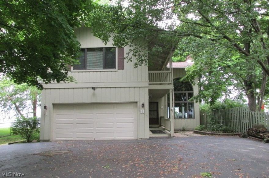 Lovely California contemporary.  Great view of Lake Erie with solid break wall and jetties.  Vaulted ceilings.  Loft overlooking the living room.  Gorgeous views of downtown Cleveland skyline from kitchen window.  Large deck with step-down off living room.  There is a small sitting room at the top of the second floor stairs with great view of the lake.  Huge master bedroom with full wall of closets.  Bedroom two also features an abundance of closets and an adjoining bath.  Beautiful lakefront setting.  House is City of Euclid compliant.