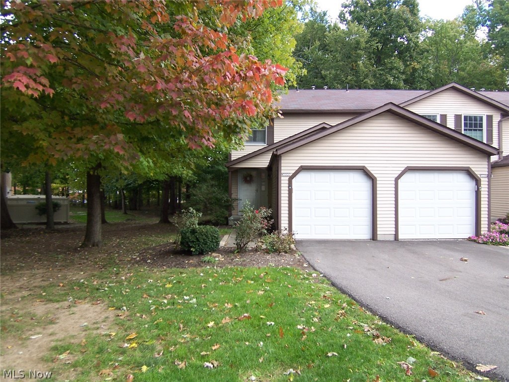 Welcome to 3899 Lake Run Blvd! This lovely townhouse has been beautifully maintained and nicely updated and is an end unit with a private back and side yard! The kitchen has newer stainless appliances (stove and refrigerator), oak cabinets w/under counter lighting, ceramic tile floors, and a breakfast bar. The living room has sliders to the private patio and backyard. Upstairs are two spacious bedrooms - both with large closets and ceiling fans. The master has newer carpet (2 years) and a sitting area w/built-in shelves. The lower level has been finished with a fireplace, a ceiling fan, and a beautiful wet bar! There is also a laundry area (washer and dryer are included with the sale), and utility area. Updates include oak kitchen cabinets (wallpaper removed and painted), ceramic tile floors in the kitchen, the half bath, as well as the foyer entry & hallway. There are newer light fixtures in the foyer and kitchen; track lighting in the living room, ceiling fans with lights in both bed
