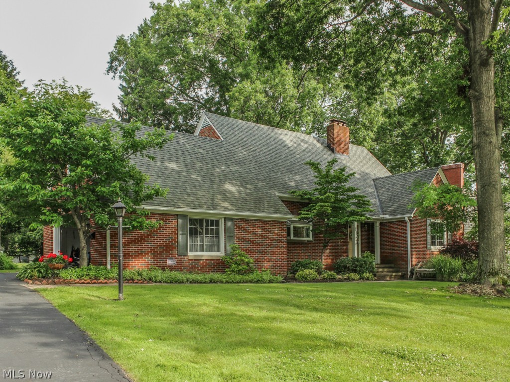 This is the family home you've been waiting for - Silver Lake Estates - all brick Cape Cod home. Loads of charm and character. This 3 (possibly 4) bedroom with lovely kitchen and large dining area. This home has hardwood floors throughout. Enjoy the screened porch and beautiful yard this summer. Make a game room out of the partially finished basement. There is an adorable knotty pine family room and full bath on the first floor. The large lot features beautifully mature landscaping. Extra large Master Bedroom upstairs. The Lake awaits you!