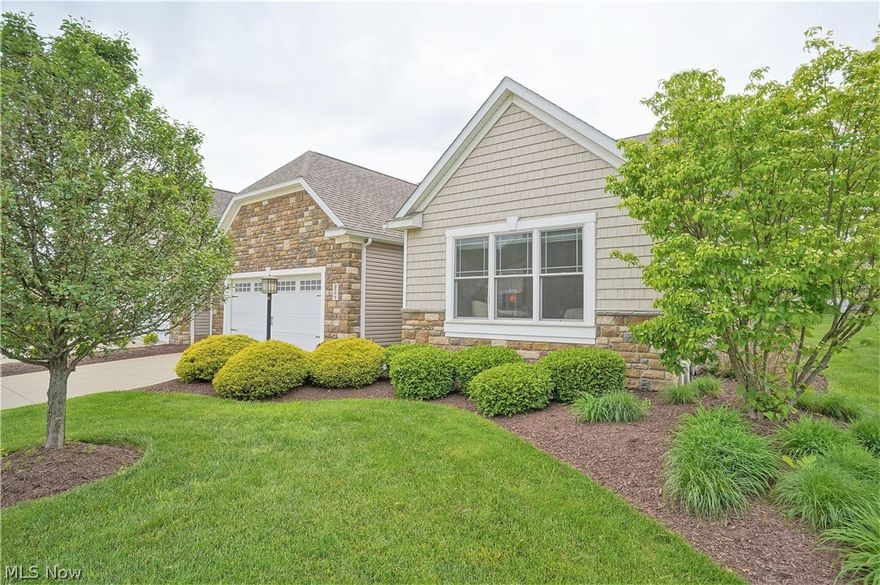 If you are looking for low maintenance living this end unit ranch cluster home is a great choice! Conveniently located on a cul-de-sac street and near shopping and restaurants. Walking into the foyer you will notice a high-volume ceiling and walnut flooring. The open floor plan offers such a spacious feeling. The great room boasts a vaulted ceiling, gas fireplace and is open to the kitchen, dining room and sunroom. There is an office located off the foyer as are 2 bedrooms and a full bath. The vaulted kitchen with lots of cabinets and counter space is open to the living area and has a center island with quartz countertop and a breakfast bar for casual dining. The stainless-steel refrigerator, range/oven, microwave and dishwasher will remain in the home. The walnut flooring spans from the front door in the foyer throughout the kitchen, dining room and sunroom. The sunroom has steps that lead to the oversized patio at the rear of the home and overlooks the greenspace.  The owner’s suite