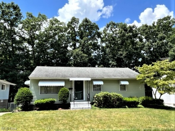 Pride of ownership reflects throughout in this lovingly cared-for Ranch, by the same owner for 58 years! You will enjoy the living room w/large picture window that leads to the dining room which opens into the remodeled kitchen. Home offers 3 nice-sized bedrooms; 2 have hardwood floors. Walk-out lower level offers a grand Rec Room w/wet bar for your entertaining, additional 2nd full bath and a 2nd kitchen open to the Rec Rm. Walk out to an inviting 3-season room addition overlooking the rear yard. Updates include hot water tank in 2019, updated electric panel, new lower-level toilet in 2023. 2.5 car detached garage built in the mid-1990's. Gated, fenced yard for your relaxation.